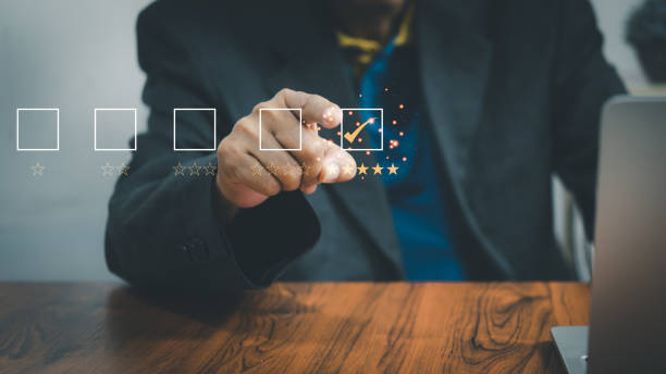 istock Business people use laptop computers survey and rate satisfaction give a 5 star shape on a virtual digital screen satisfaction rating. Survey concept.Customer service 1429595174
