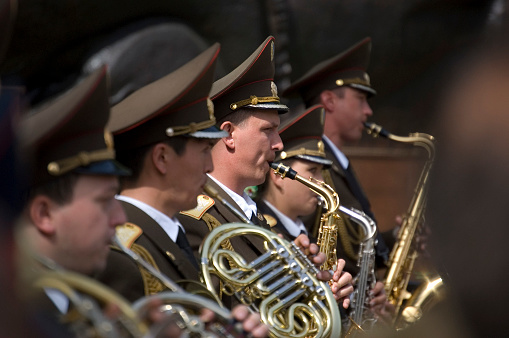 Victory Day is a celebration day that commemorates the victory of the Soviet Union over Nazi Germany in the Great Patriotic War. (Second World War). In Kazakhstan on the 9th of May the people remembering their Heros in the Panfilov Park. The image shows a military music group, captured during springtime.