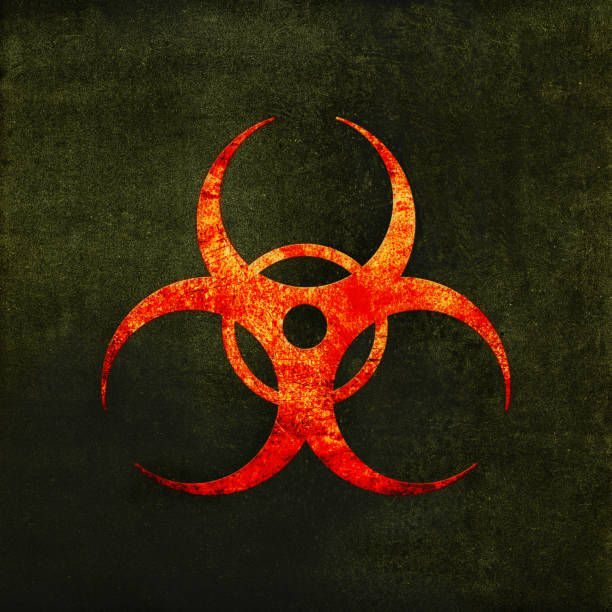 istock Biohazard sign, red on gray. Biological threat emblem, grunge textured 1429597237