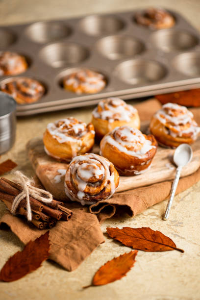 istock homemade pastry Cinnamon Roll Buns in rustic autumn kitchen with fresh icing sugar 1429597312