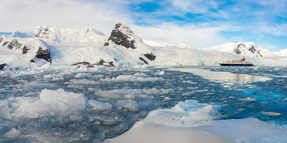 Antarctic iceberg landscape in Cierva Cove - a deep inlet on the west side of the Antarctic Peninsula, surrounded by rugged mountains and dramatic glacier fronts.