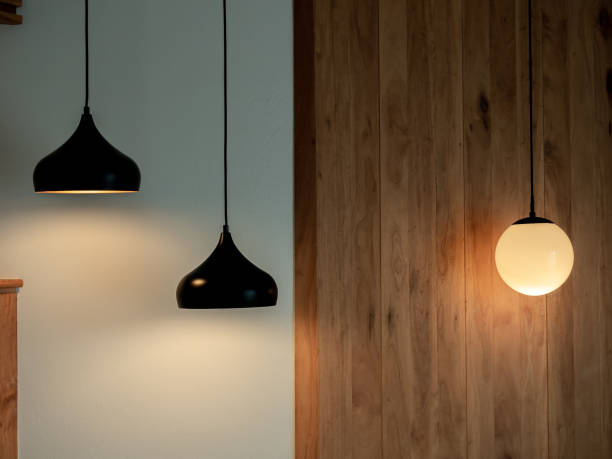 istock Twin ceiling lighting in the dark room. Two hanging lamp or round ceiling lamp decorated as a steps and round light full moon shape on white and wood wall. 1429599765