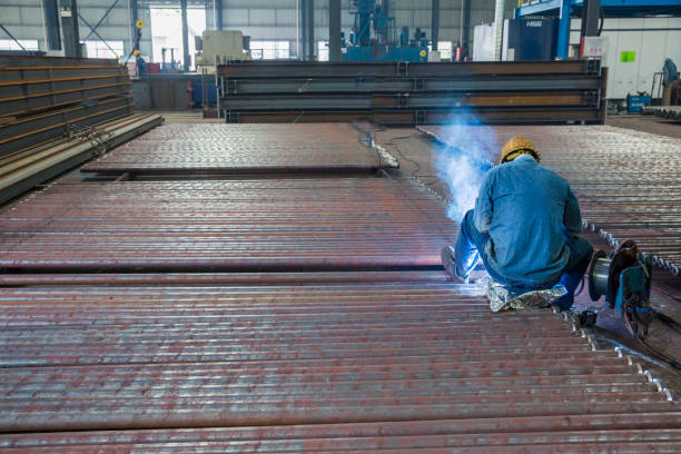 Heavy industry, welding, workers, sparks, steel, machinery, manufacturing
