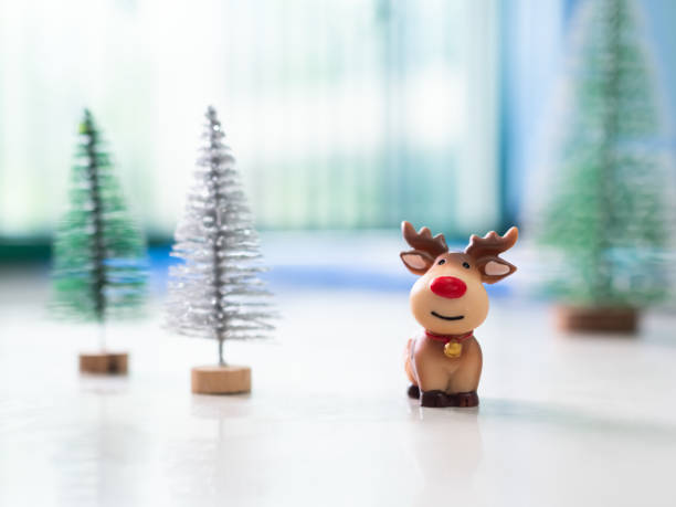 Funny reindeer with Santa Claus hat and decoration on the antler isolated on white background 3D rendering