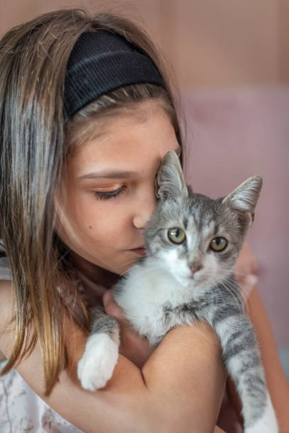 istock A girl is playing with her cat 1429606308