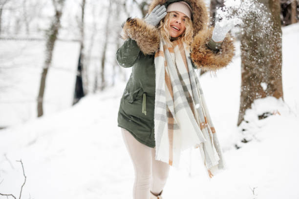 istock Cheerful woman having fun in snow 1429611907