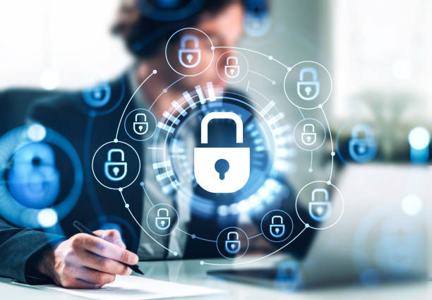 istock Businessman take a note, cybersecurity hologram with padlock, data protection 1429614532