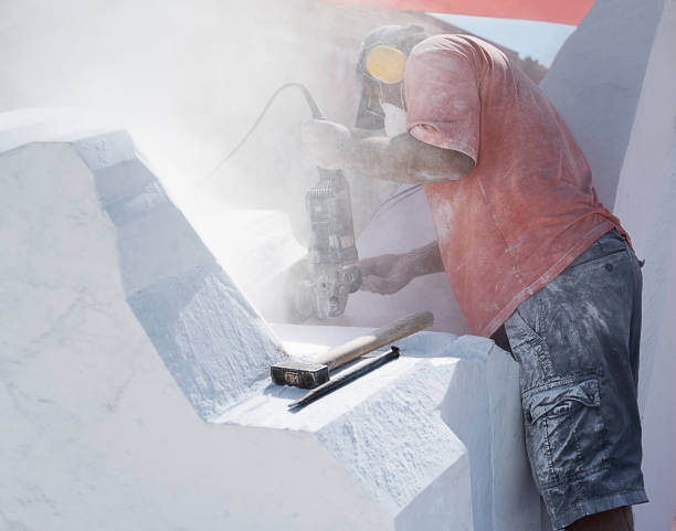 istock creating marble sculptures with electric tool, hammer and carving tool 1429616626