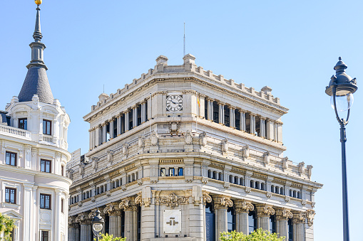 Madrid, Spain - September 30, 2022: Colonial-style architecture on the facade of a centric building. There are no people on the scene.