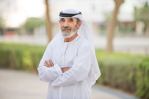 Arabian senior man with traditional white kandura portrait