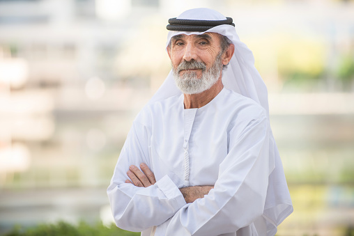 Arabian senior man with traditional white kandura portrait