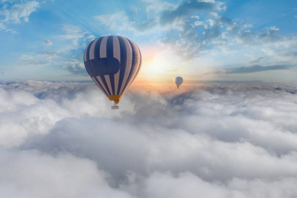 istock Colorful hot air balloon flying above the clouds. 1429619113