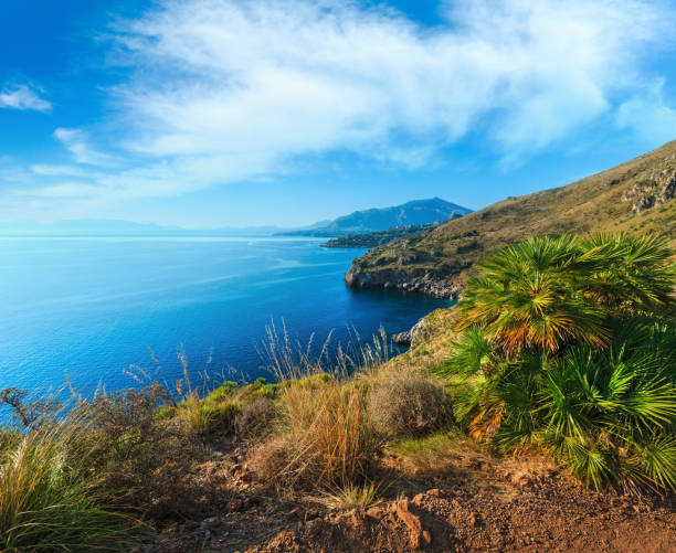 Paradise sunrise sea landscape from coastline trail of Zingaro Nature Reserve Park, between San Vito lo Capo and Scopello, Trapani province, Sicily, Italy