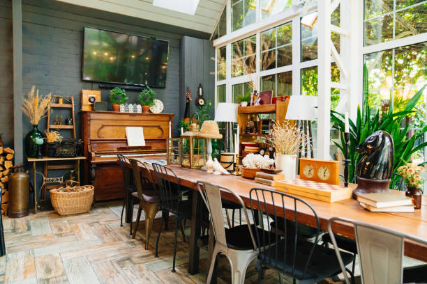 large wooden dining table with retro decor items. collecting antiques. vintage in the interior.