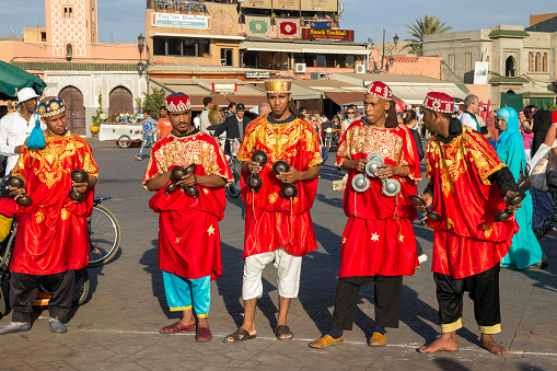 Gnawa Musicians performing on the Djemaa El Fna square In Marrakech, Morocco. Marrakech, Morocco - April 29, 2016.