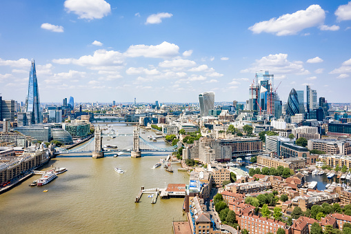 Aerial view of Tower bridge, Shard and City of London on a sunny day.