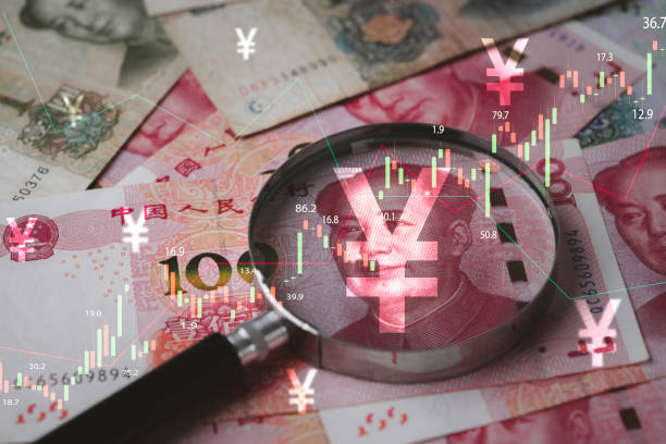 closeup on magnifier glass with mao tse tung on yuan banknote and stock market graph for currency exchange and interest rates concept. - tax financial figures analyzing banking document imagens e fotografias de stock