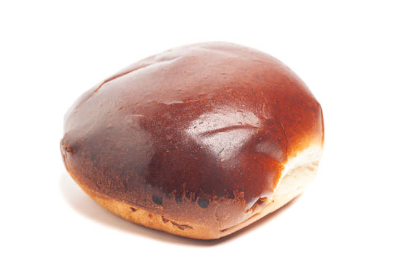 istock fresh baked wheat bun isolated on white 1429629176