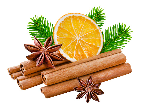 Cinnamon sticks and oranges with star anise isolated on white background