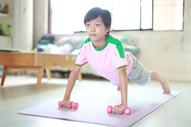 istock Boy exercising  at home 1429634359