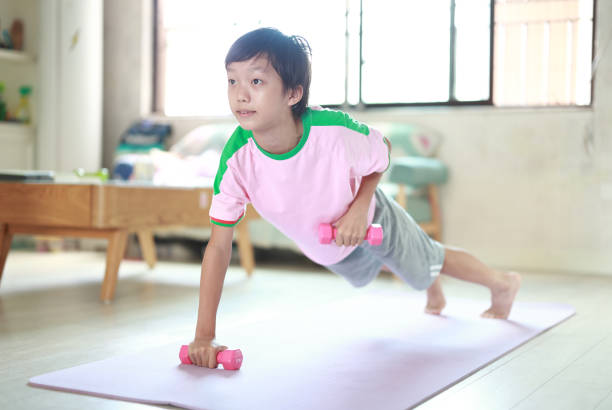 istock Boy exercising  at home 1429634360
