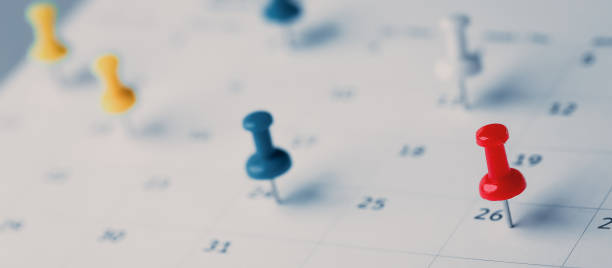 istock Embroidered red pins on a calendar event Planner calendar,clock to set timetable organize schedule,planning for business meeting or travel planning concept. 1429636042