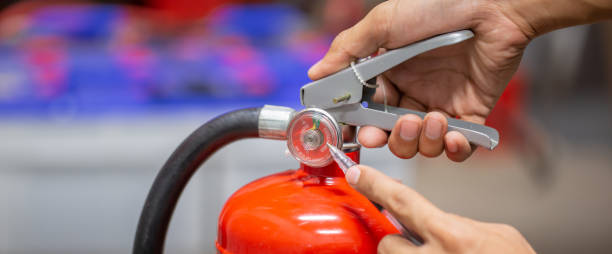 istock Engineer are checking and inspection a fire extinguishers tank in the fire control room for safety training and fire prevention. 1429636087