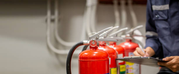 istock Engineer are checking and inspection a fire extinguishers tank in the fire control room for safety training and fire prevention. 1429636091