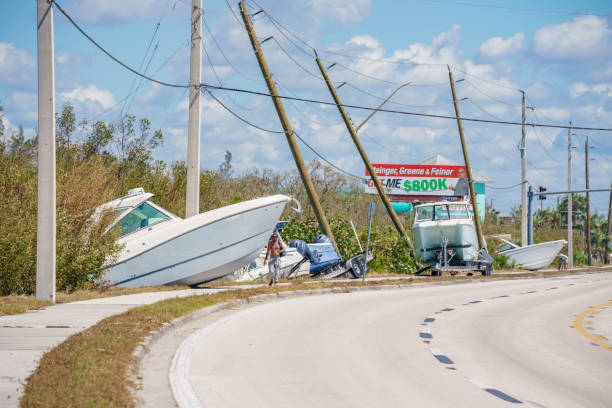 Boats laying on the side of the road in Fort Myers FL Hurricane Ian aftermath stock photo