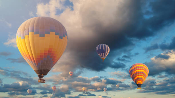 istock Colorful hot air balloon flying above the clouds. 1429642633