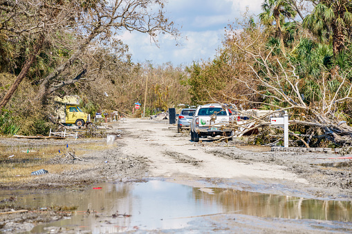 Fort Myers, FL, USA - October 1, 2022: Neighborhoods with salt water and mud on the streets after storm surge from Hurricane Ian