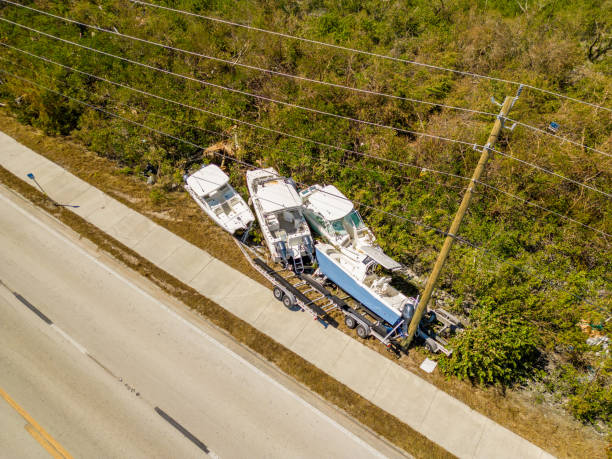 Aerial photo of boats tossed on the side of the road by heavy winds from Hurricane Ian Fort Myers FL Fort Myers, FL, USA - October 1, 2022: Aerial photo of boats tossed on the side of the road by heavy winds from Hurricane Ian Fort Myers FL hurricane ian stock pictures, royalty-free photos & images