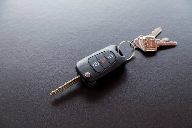 Car key on top of a black table with natural light