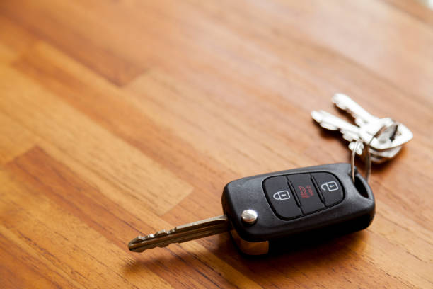 istock Car key on top of a wooden table. 1429646044