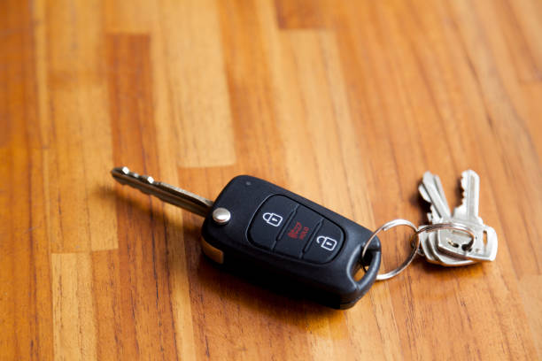 istock Car key on top of a wooden table. 1429646054