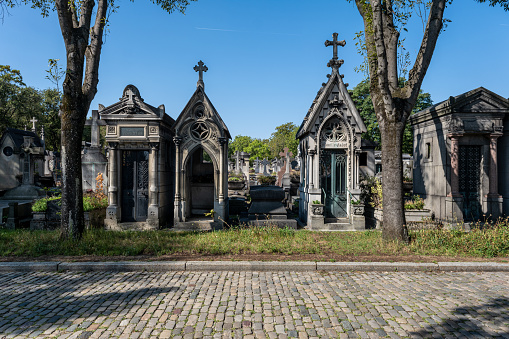 Paris, France - 31 Aout 2022: Tombstones at Pere-Lachaise cemetery