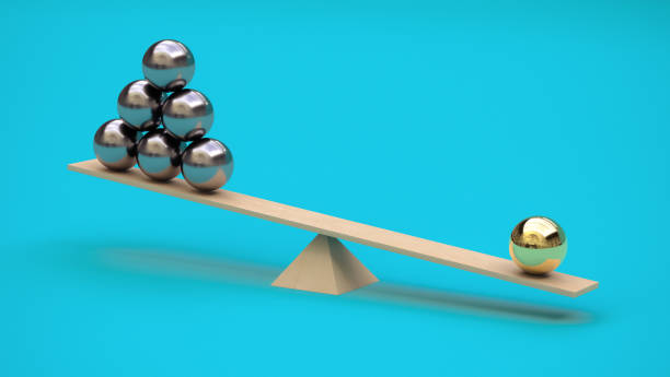 istock One gilded ball outweighs several metal balls on a swing. 3D rendering. Minimalism. Abstraction. Balance concept. Not like everyone else 1429646797