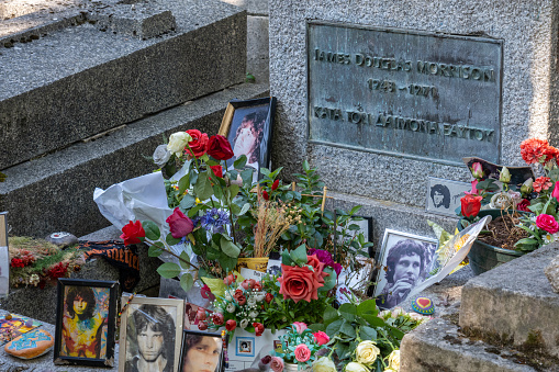 Paris, France - 31 Aout 2022: Jim Morrison Tombstone at Pere-Lachaise cemetery