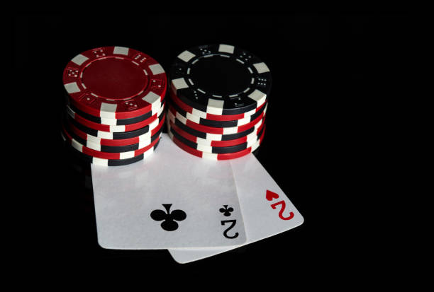 istock Poker game with one pair combination. Chips and cards on the black table. Successful and win. Free advertising space 1429649387