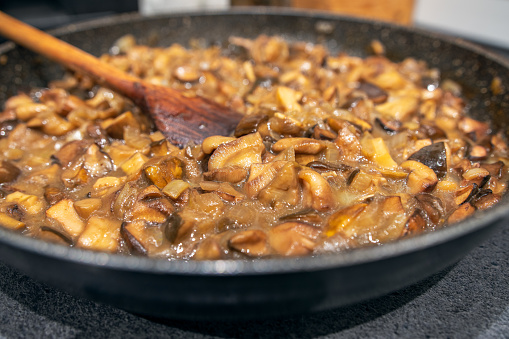Mushrooms, sliced and fried in a pan with the addition of onions. Mushroom sauce