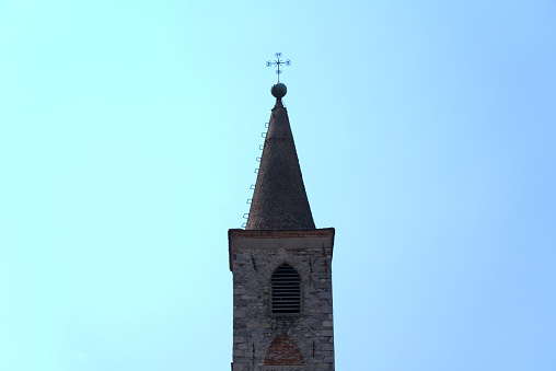 Asmara, Eritrea: slender bell tower with needle roof and cross of the Evangelical Lutheran Church - intersection of Debre Bizen Street and Afabet Street, old Piazza Tripoli, Gheza Kenisha quarter, Medeber