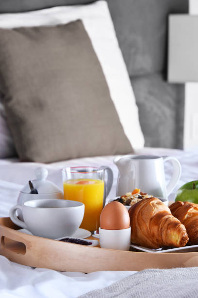 istock Breakfast on tray in bed in hotel room 1429655143