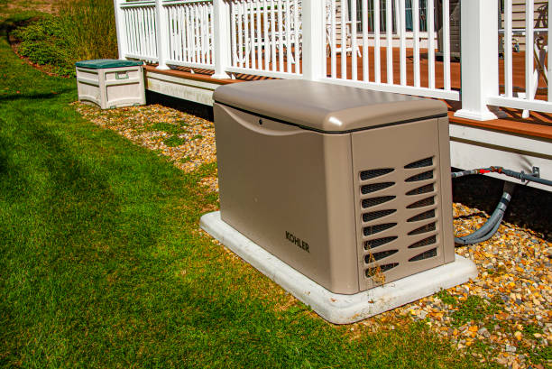 Residential generator Newbury, USA - September 29, 2022: Residential standby generator on concrete pad generator stock pictures, royalty-free photos & images