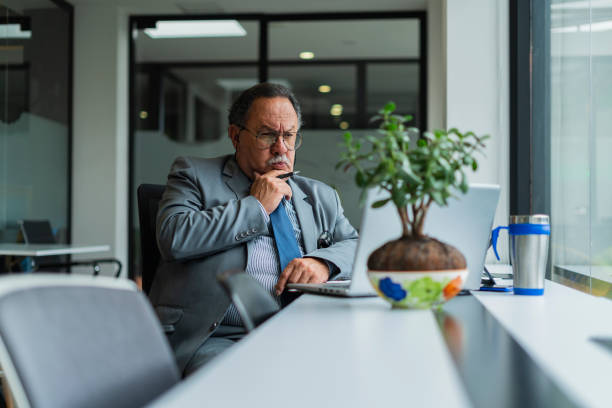 istock Businessman looks away in the office 1429656569