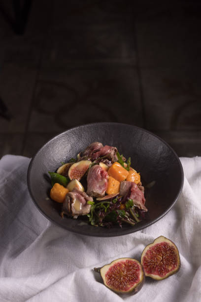 istock salad with meat, figs and pumpkin on a light fabric background 1429661293