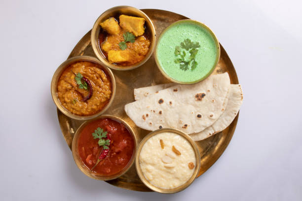 Indian Veg Thali / food platter, selective focus isolated on white background