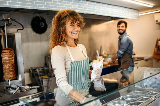 istock Woman works in a fast food shop 1429665708