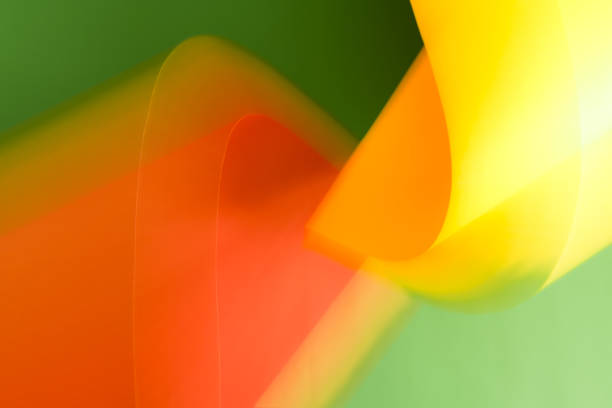 istock Blurred orange and yellow shapes on green background. 1429666157