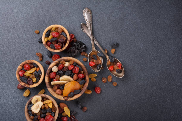 istock Wooden bowl with dried fruit, berries and nuts 1429667315