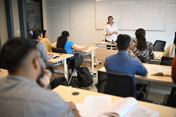 istock Female Instructor teaching mature adult students in the classroom 1429679225